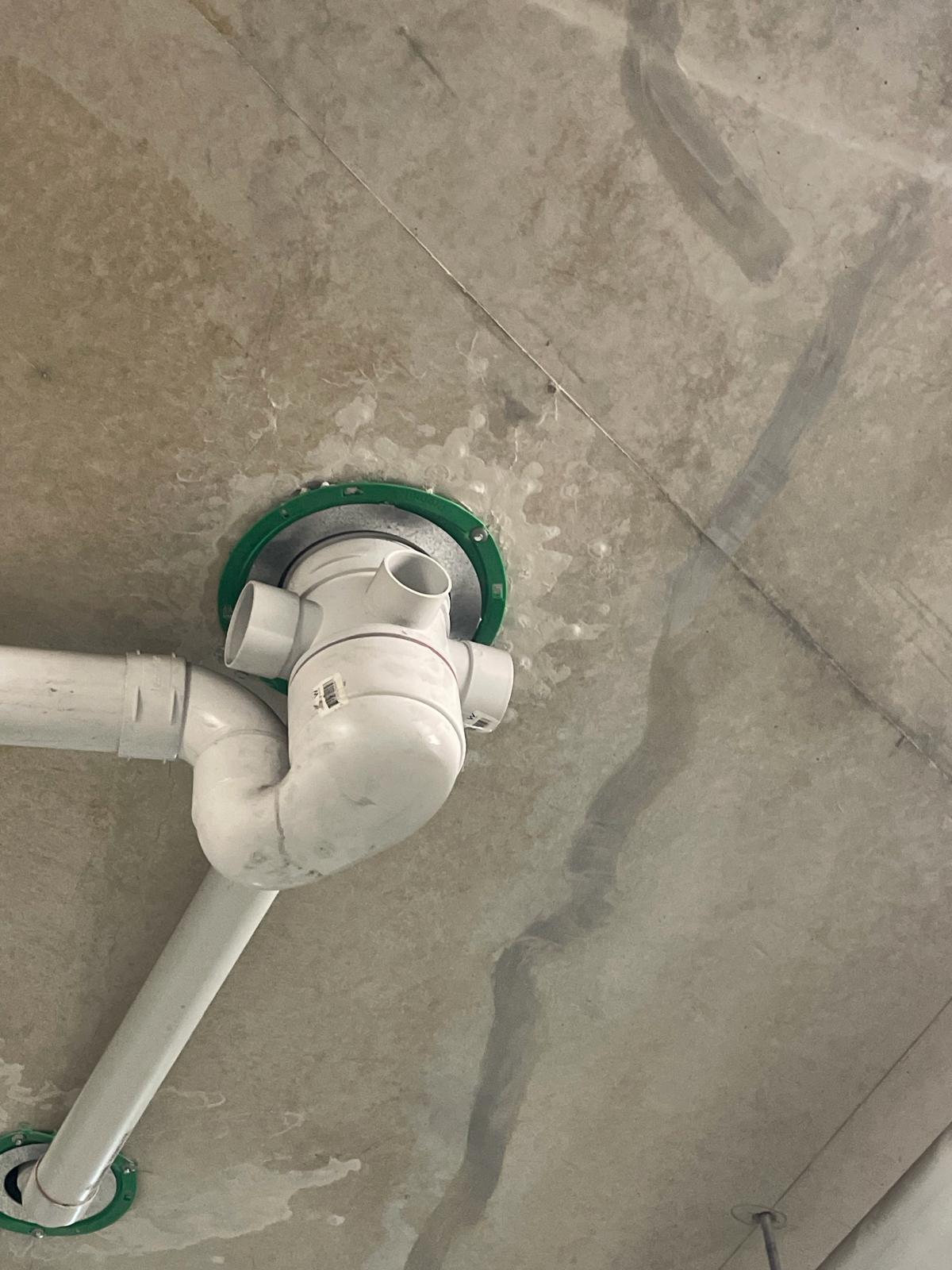 Floor waste installed through an existing stack cast-in collar before rectification